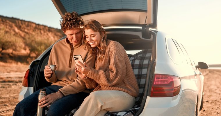 A,Happy,Young,Couple,In,Love,Sitting,In,The,Open