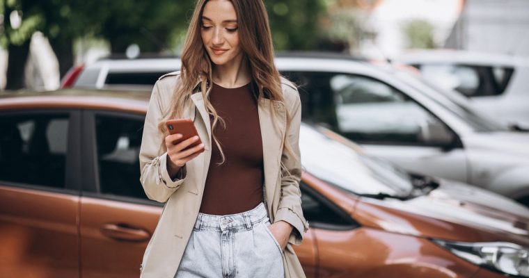 Young woman in the city center with phone